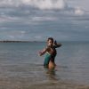 Payal dancing in the ocean.