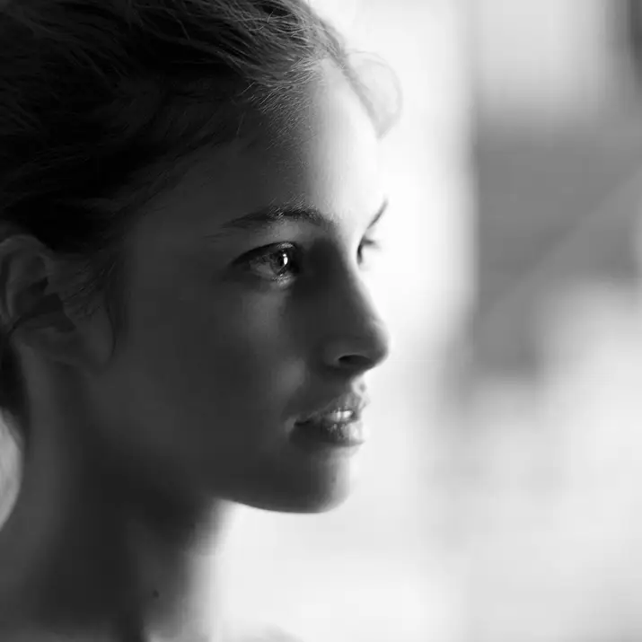 A side profile portrait of Vanessa looking ahead